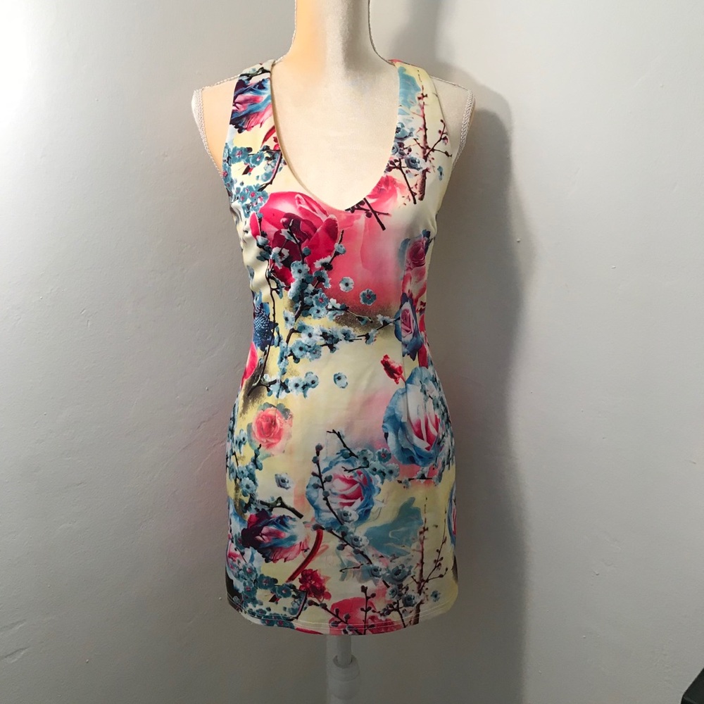 Vibrant yellow flowered dress, perfect for summer.